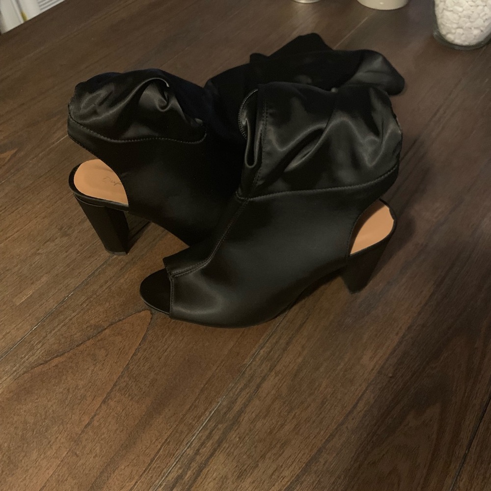 Thigh high open toe shoe.